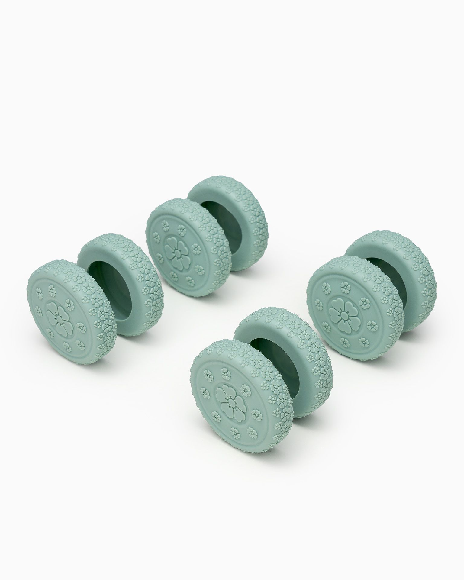 Zöld bőrönd kerekeihez való védőpárnák